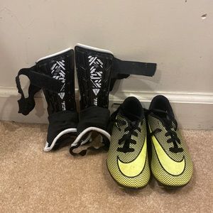 Unisex cleats with shin guards, size 10C, used but still in good condition